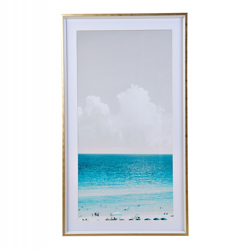 Cuadro Playa Blanco / Azul con marco de color blanco y borde dorado.